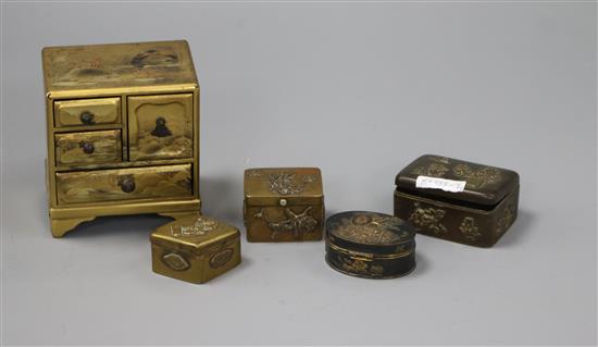 A Japanese lacquer miniature cabinet and four cast bronze boxes